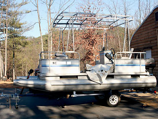 Peterborough Pontoon Boat and Trailer from High Peak Deception Non-Fiction Novel by Marla Gates