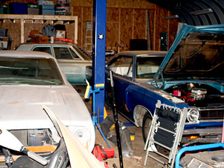 Workshop Interior Car Lift from High Peak Deception Non-Fiction Novel by Marla Gates